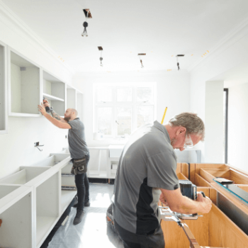 2 men remodeling kitchen