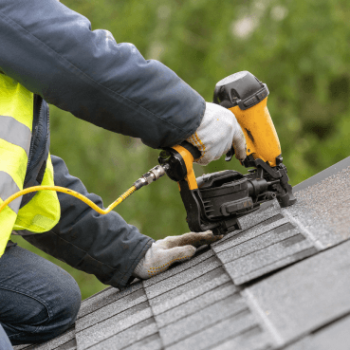 man repairing roof