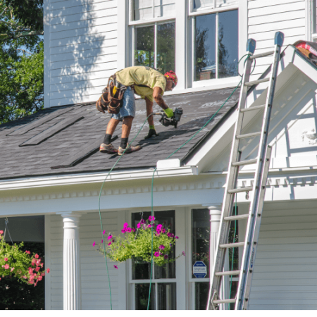 man working on roof